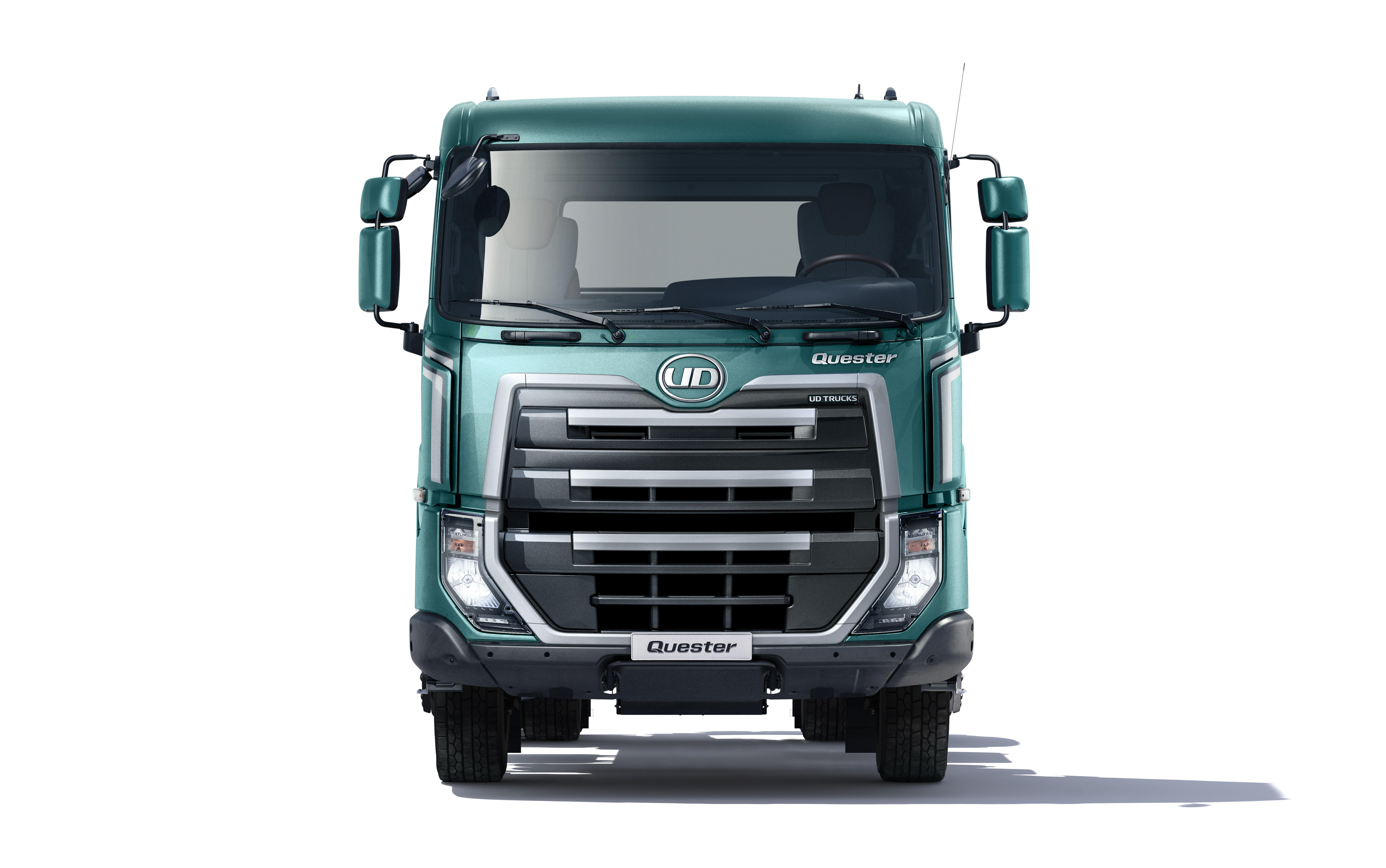 Green truck seen from the front on a white background.