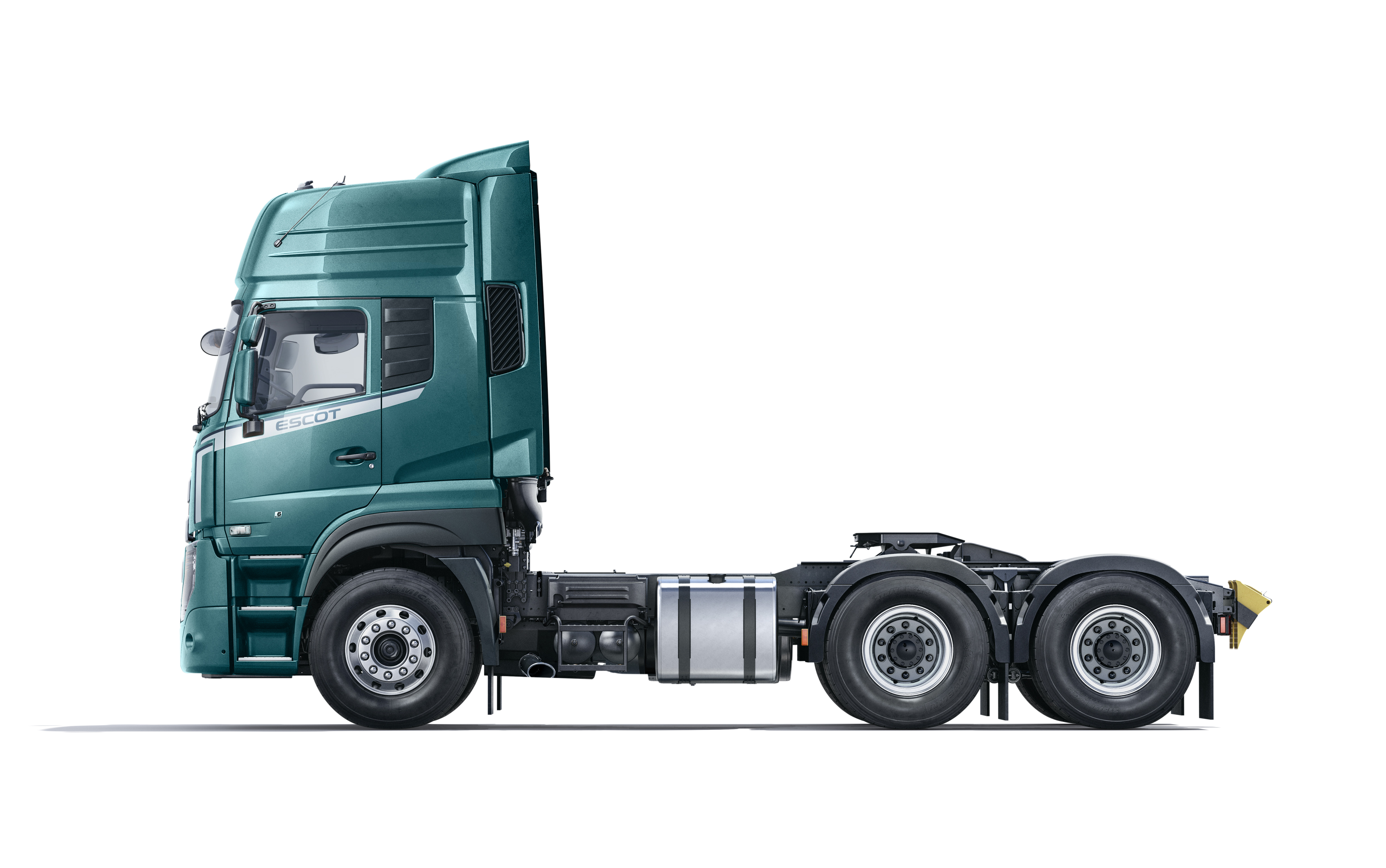 Green semi-truck Quester cab without a trailer on a white background.