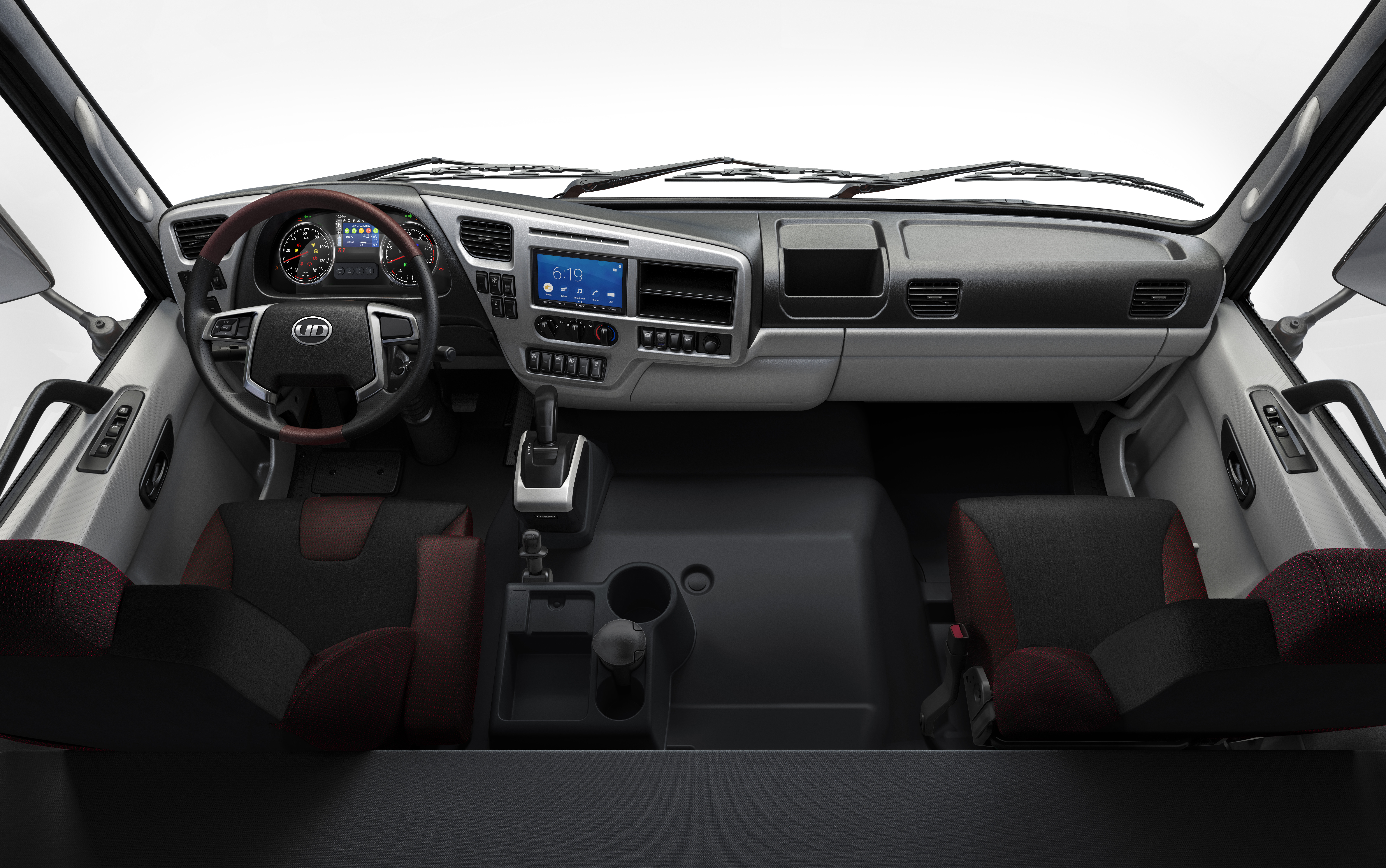 Quester Modern truck cab interior with two seats, steering wheel, and dashboard controls.