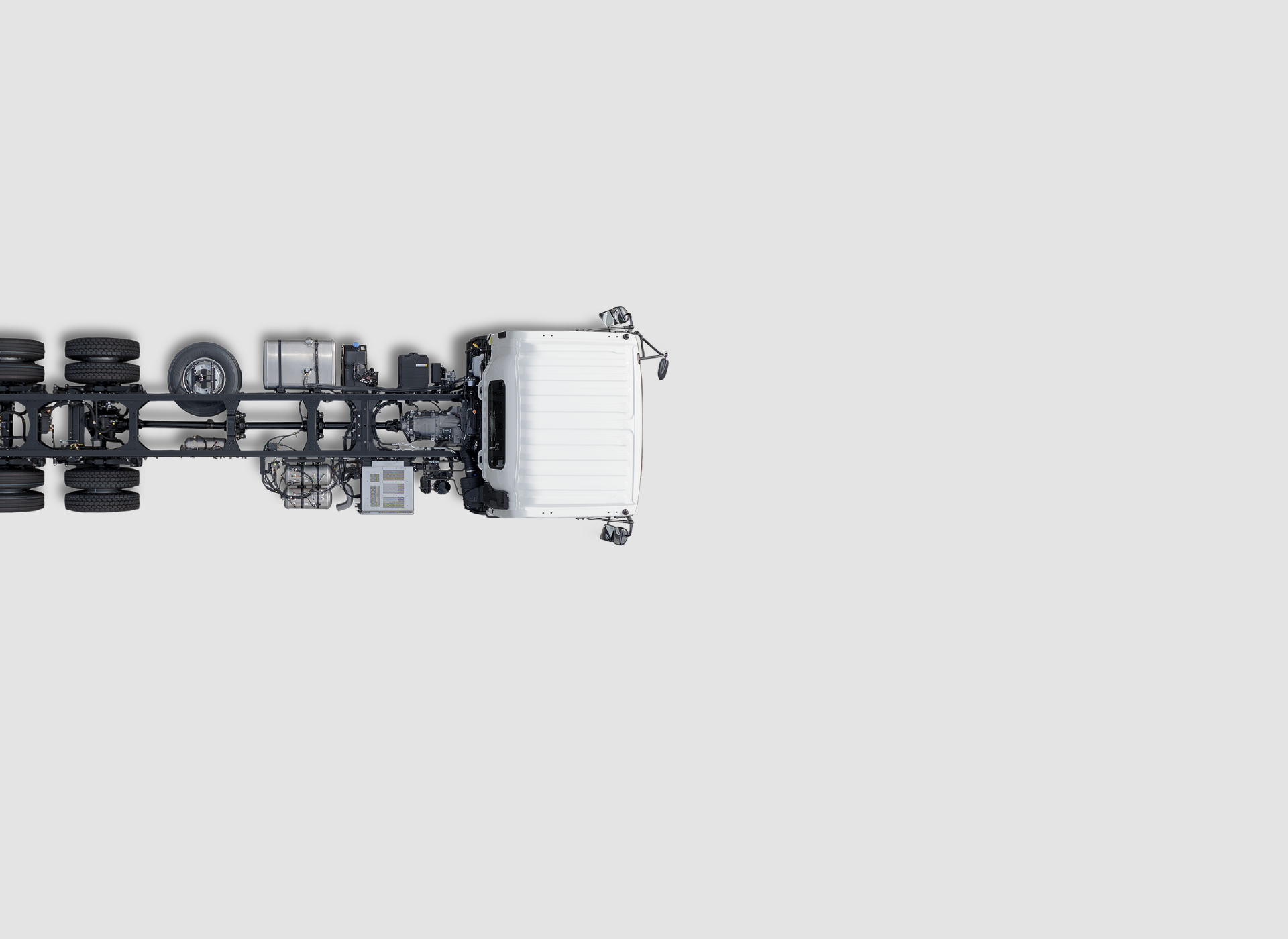 White truck chassis viewed from above on a plain light background.
