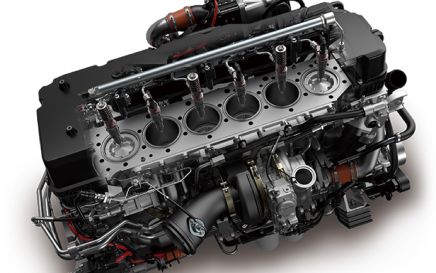 Detailed view of a car engine showing internal cylinders and components.