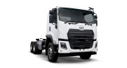 White cab-over truck with empty chassis on a plain white background.
